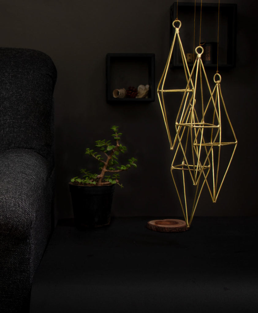 brass wind chime hanging in the living room