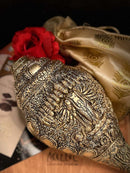 brass engraved  shankh conch with Lord vishnu motif is kept on akkaara hamper box