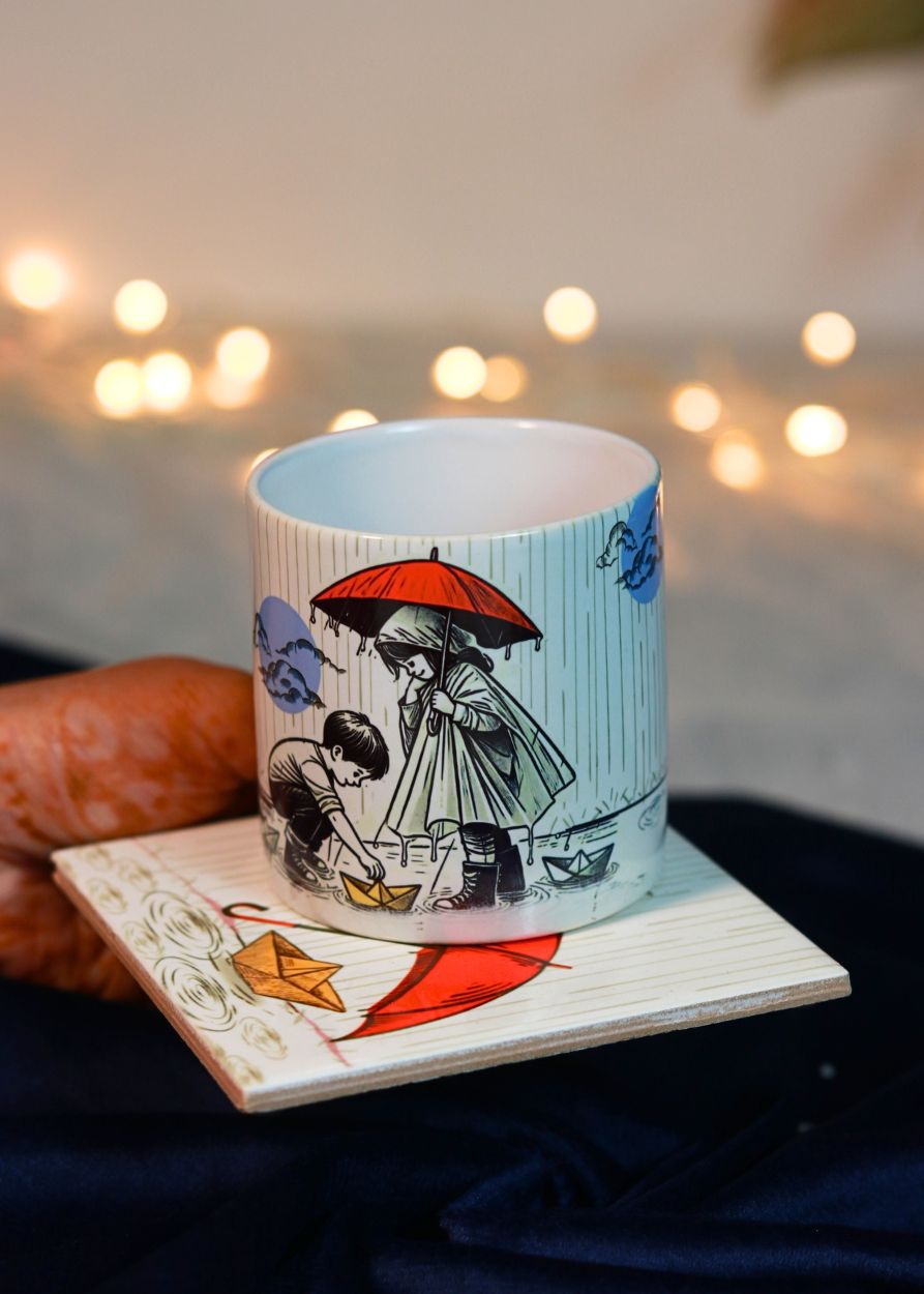 a printed ceramic coffee mug kept on printed ceramic coaster